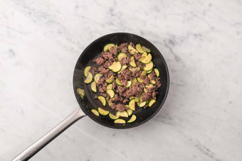 Cook sausage and zucchini