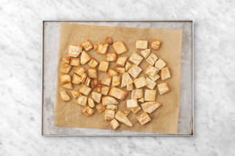 Bake the pita croutons & cook the fish