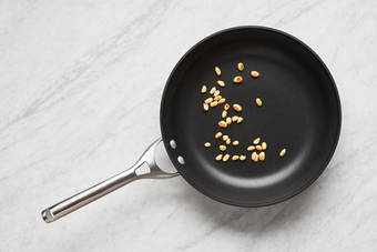 Toast peanuts and cook chicken