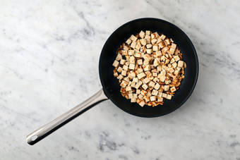 Toast almonds and flatbread croutons