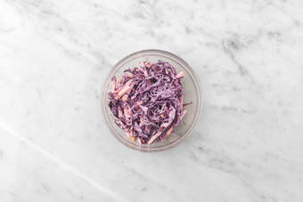 Make cabbage-apple slaw