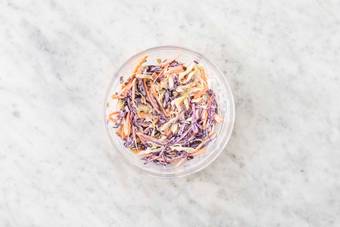 Make lime crema and mix coleslaw
