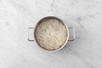 Cook rice noodles