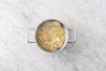 Cook the egg noodles & get prepped