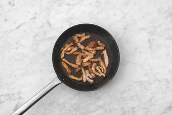 Varkensreepjes bakken