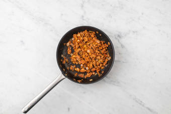 Cook onions and Beyond Meat®