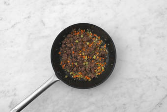 Cook veggies and Beyond Meat®