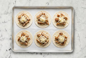 Assemble quesadillas