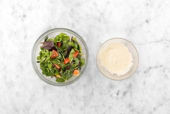 Make hummus dressing and salad