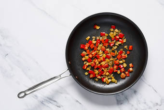 Cook peppers and onions