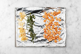 Broil chicken and veggies