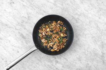 Cook sausage and mushrooms