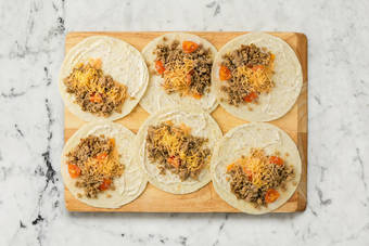 Assemble quesadillas