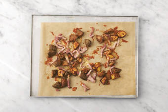 Bake the cheesy bacon potato chunks