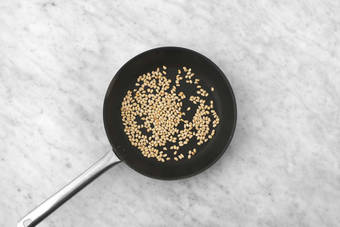 Toast pine nuts