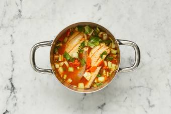 Simmer broth and cook shrimp