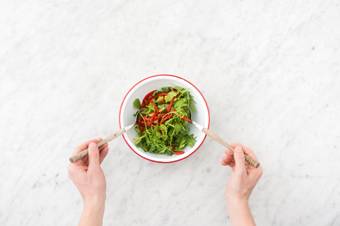 Toss the salad and serve