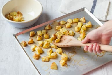 Chop potatoes into cubes
