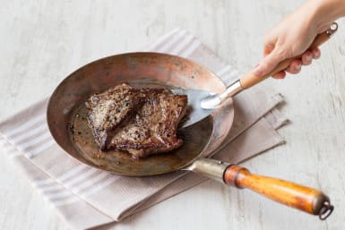 Steak in frying pan when cooked