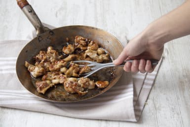 Cook chicken in pan