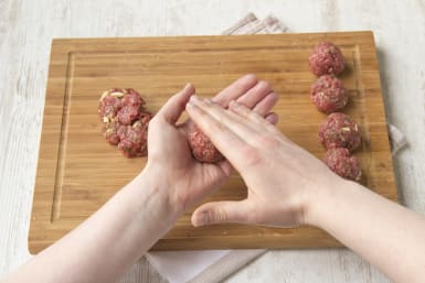 Season meat and form meatballs