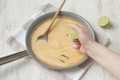 Squeeze lime juice into the laksa