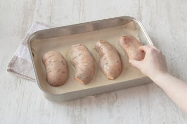 Place the sweet potatoes on a baking sheet