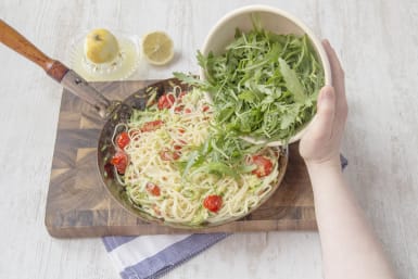 Mix linguine with vegetables and rocket