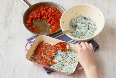 Spread ricotta and spinach mixture on to lasagne sheets, then the tomatoe sauce