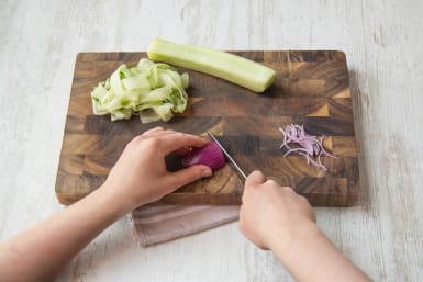 Peel and very thinly slice the red onion as thin as your knife skills allow