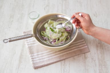 Leave the mix of onion and cucumber in the colander