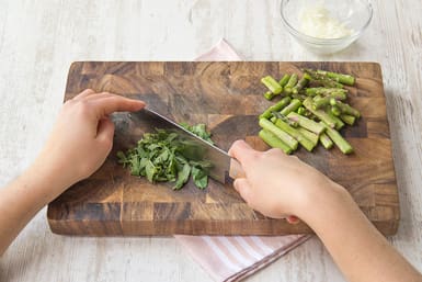 Dice onion, grate garlic and trim asparagus