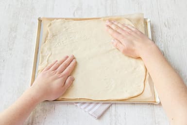 Roll out the pizza dough