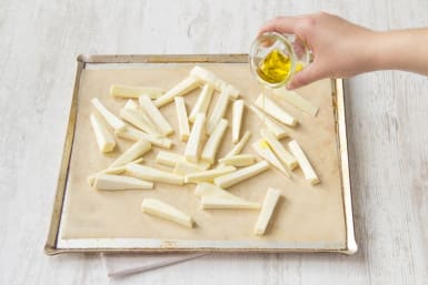 Place parsnip fries onto a lined baking tray