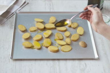 Drizzle oil on potatoes