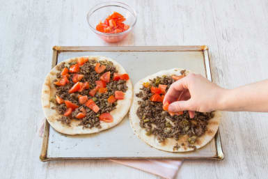 Put your ingredients on your flatbreads