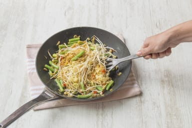 Add your drained noodles to the pan