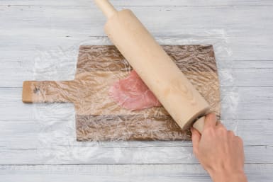 Bash Pork with a rolling pin