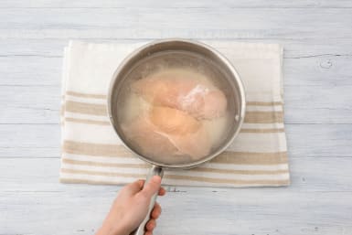 Boil chicken breasts