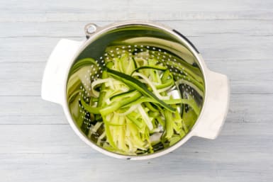 Place the zucchini in a colander