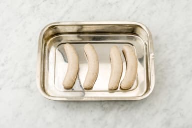 Put the sausages on a baking tray