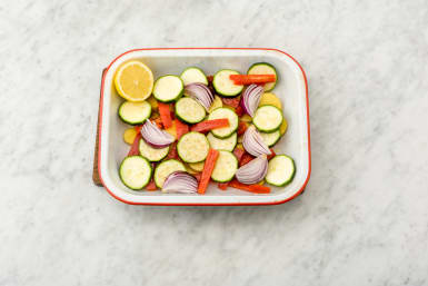 Place vegetables in baking dish and cook