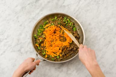 Stir through the grated carrot and green beans and cook