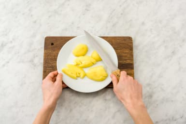 Smash potatoes using a chef's knife