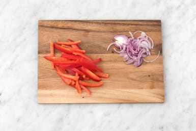 Cut red onion and pepper.