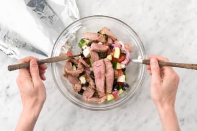 Toss the lamb slices through the salad