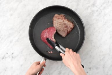 Cook the steaks on each side