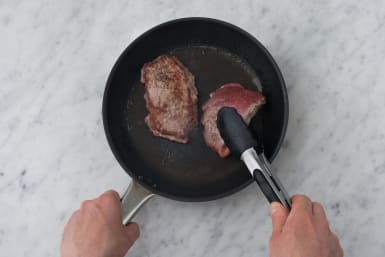 Cook the steak on each side