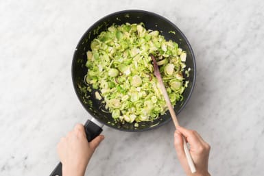 Cook onion and brussels sprouts