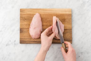 Cut a slit into each chicken breast